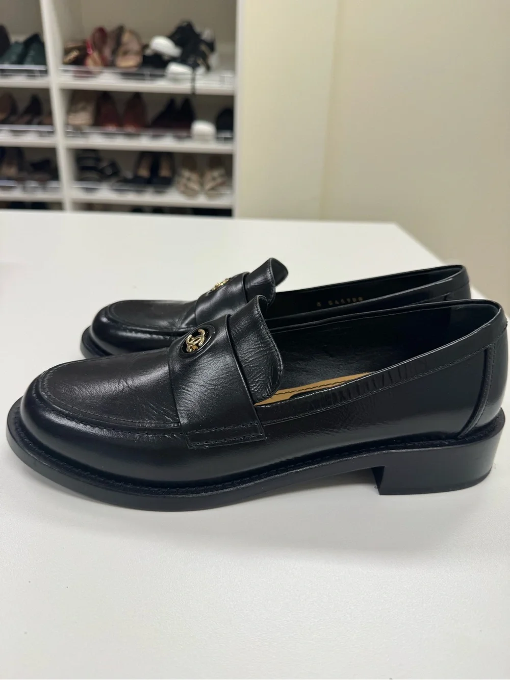 CHANEL Black Leather Loafers with Gold CC Medallions